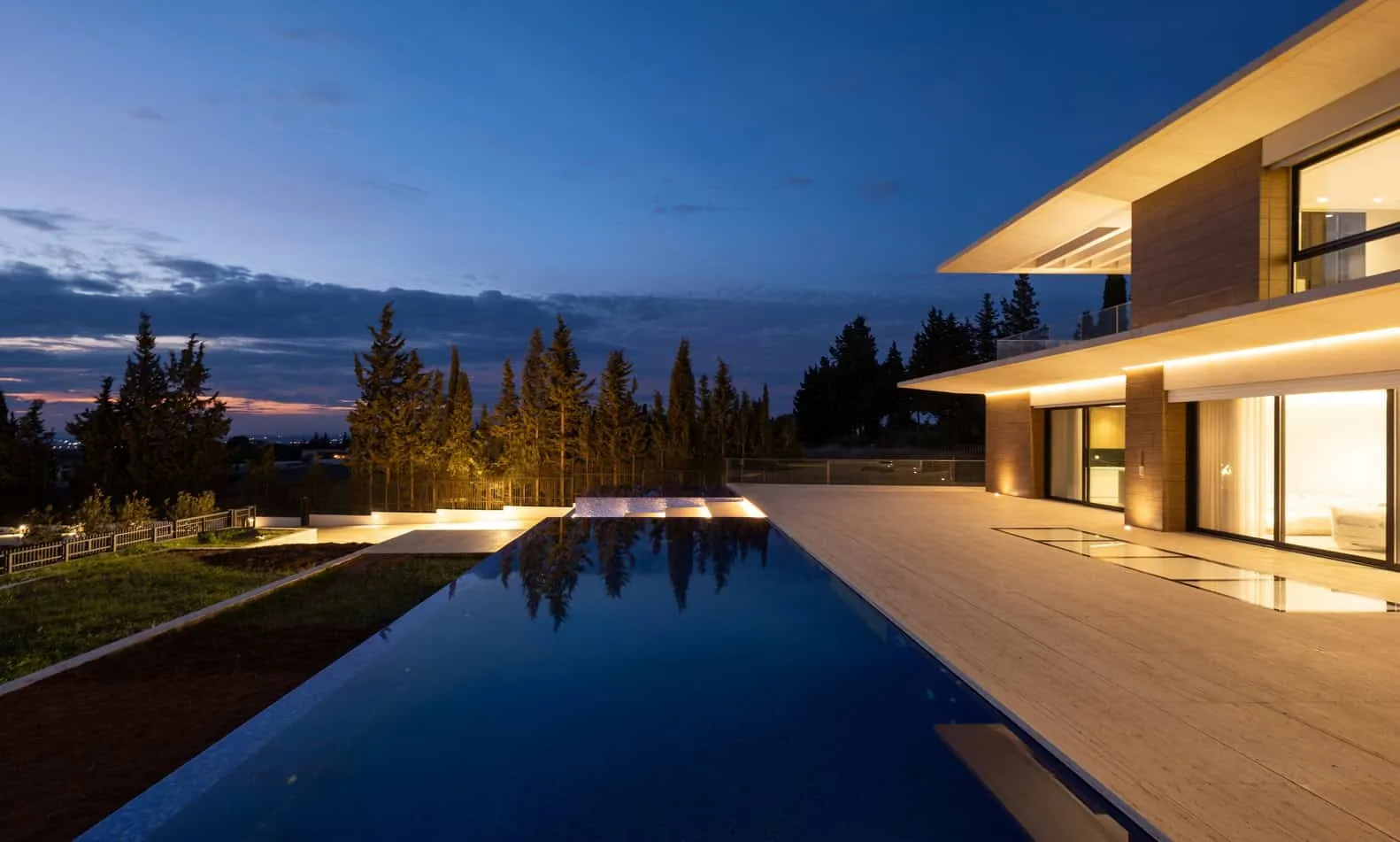 Night view from the upper terrace of Villa Air with soft lighting and open area