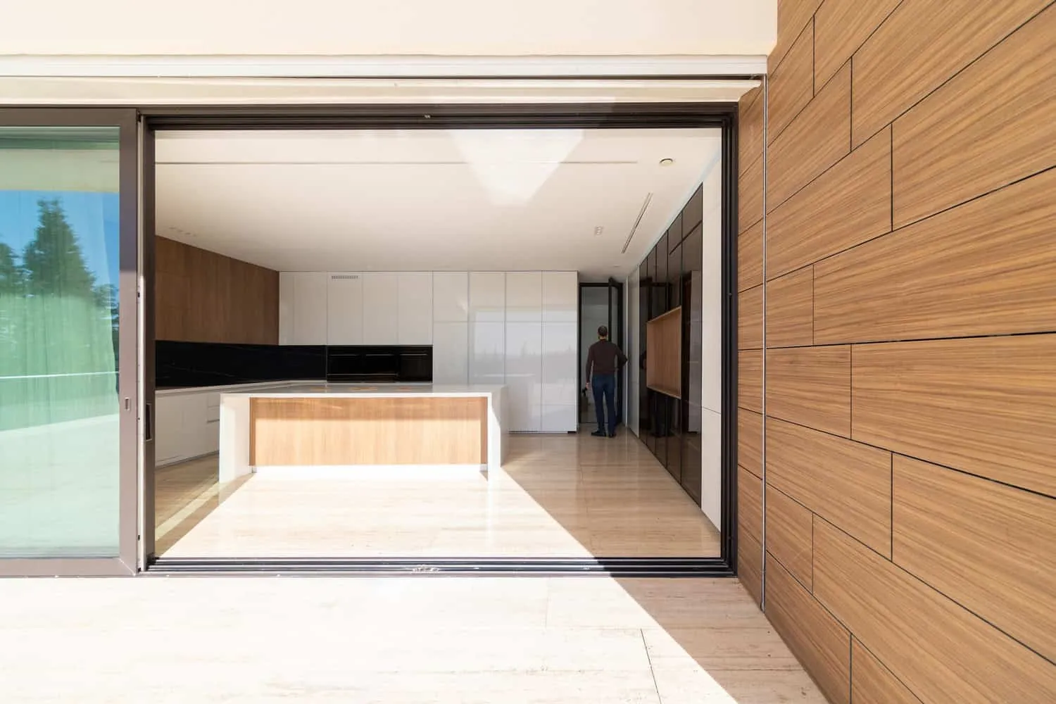 View of the modern kitchen in Villa Air through sliding glass doors
