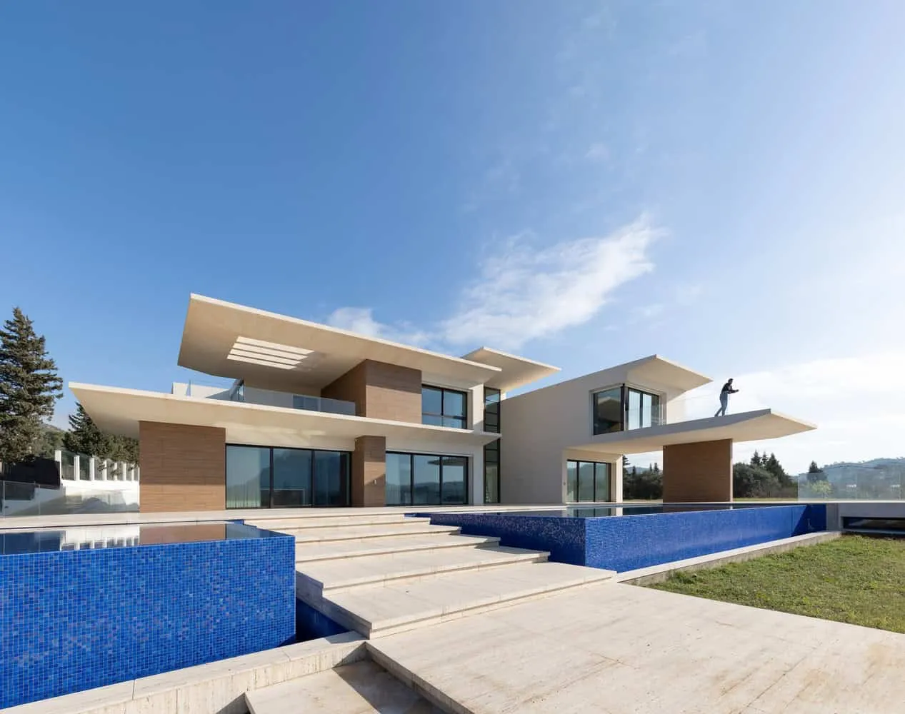 Modern villa with protruding roofs and clean white facade in Tunisia