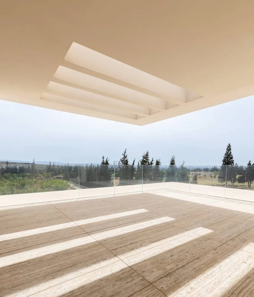 Sharp protruding roof with modern slits against the clear sky