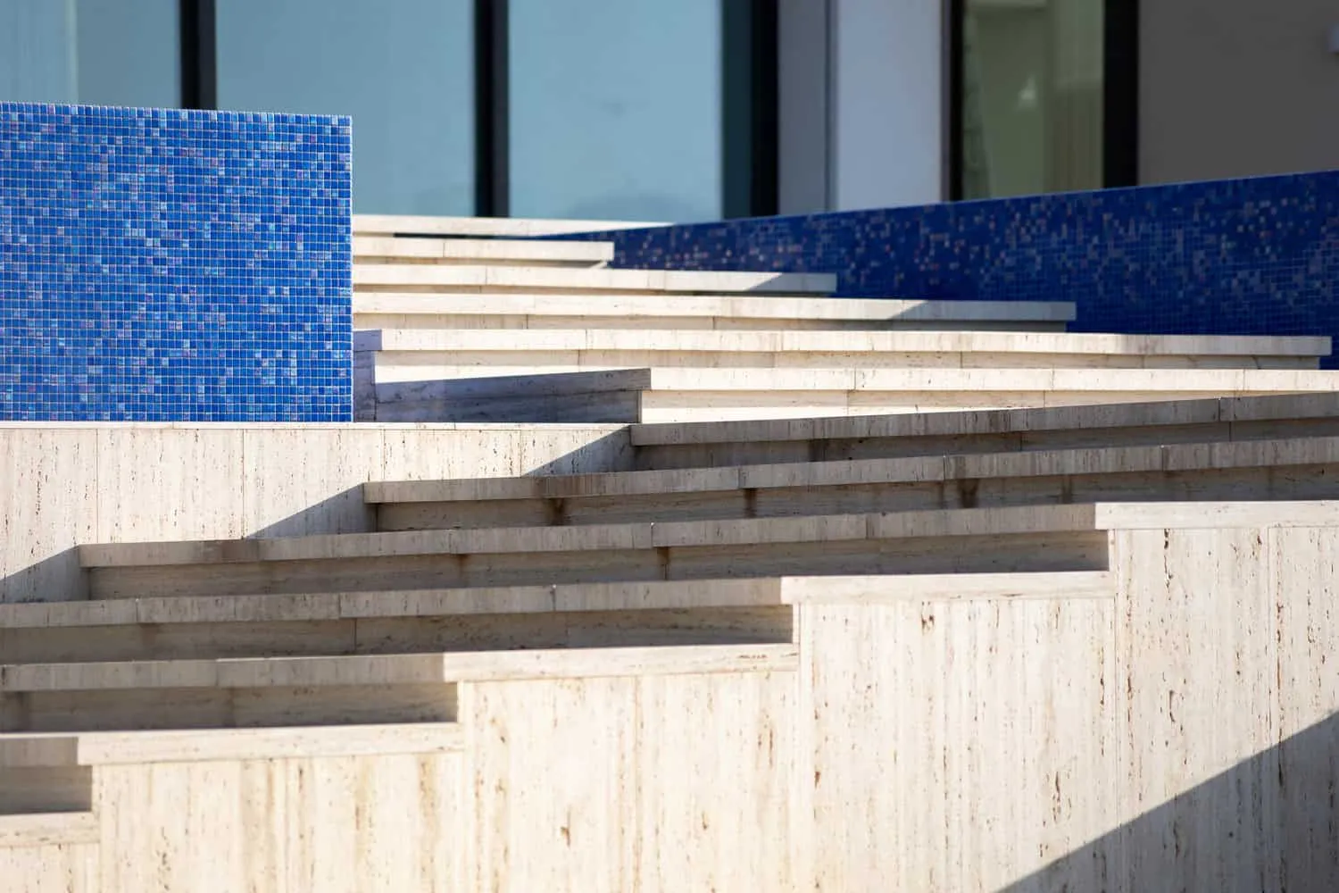 Edge of the infinity pool revealing a vast Tunisian landscape and mountains