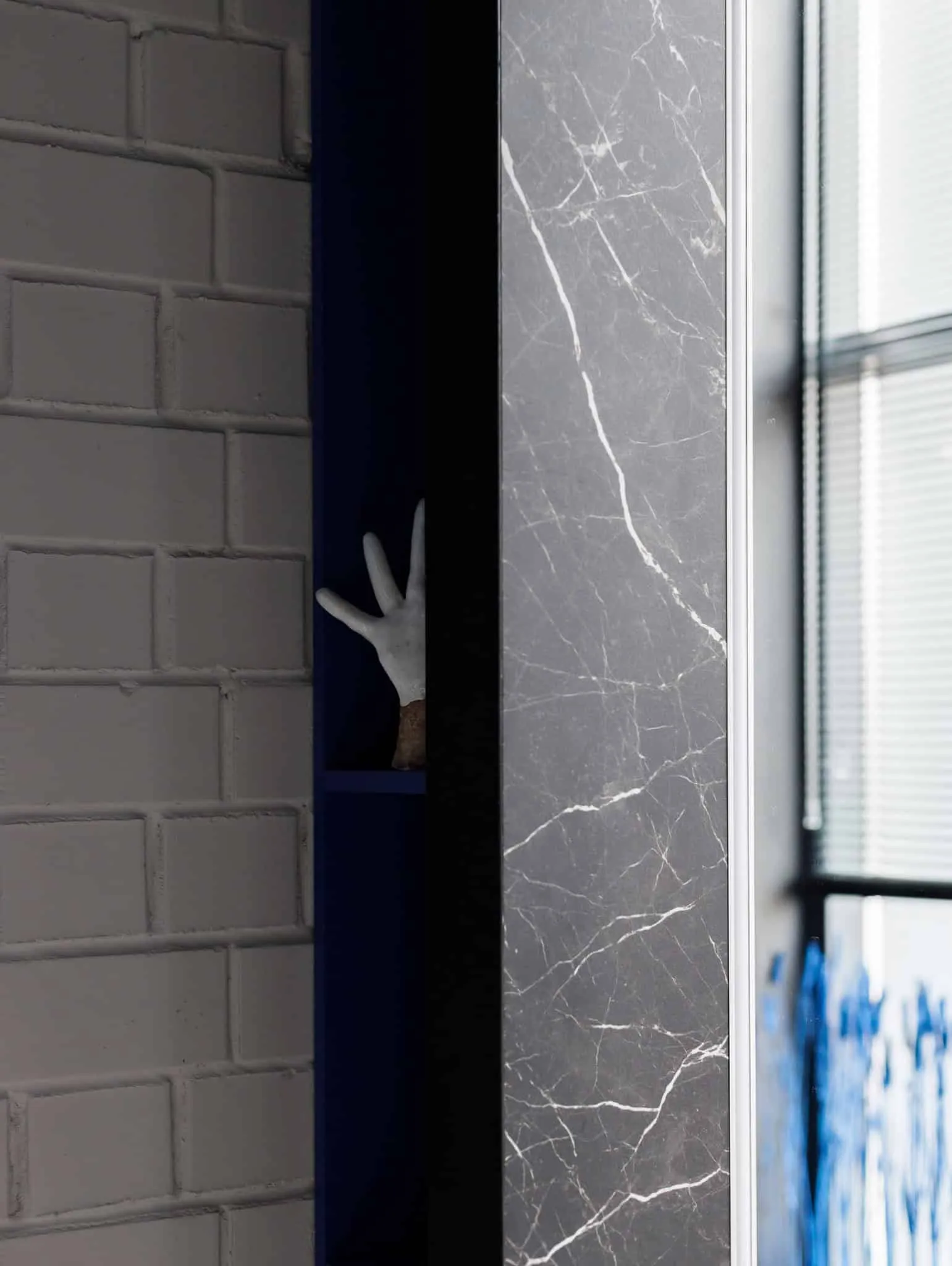 Modern minimalist interior by Julia Starikova – marble and brick detail in Chelyabinsk, Russia