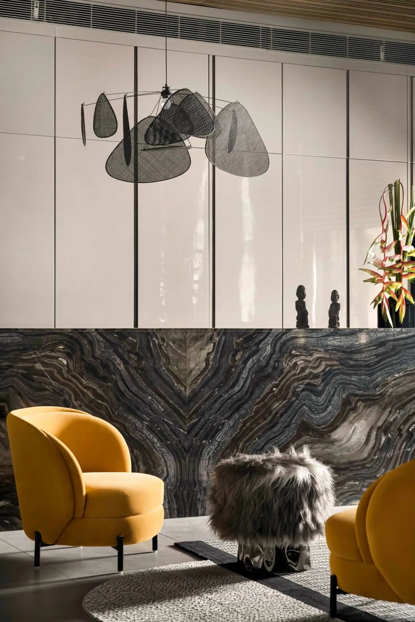 Sofa corner in UrbanMistrii's Pool House in Chatarpur, Delhi.