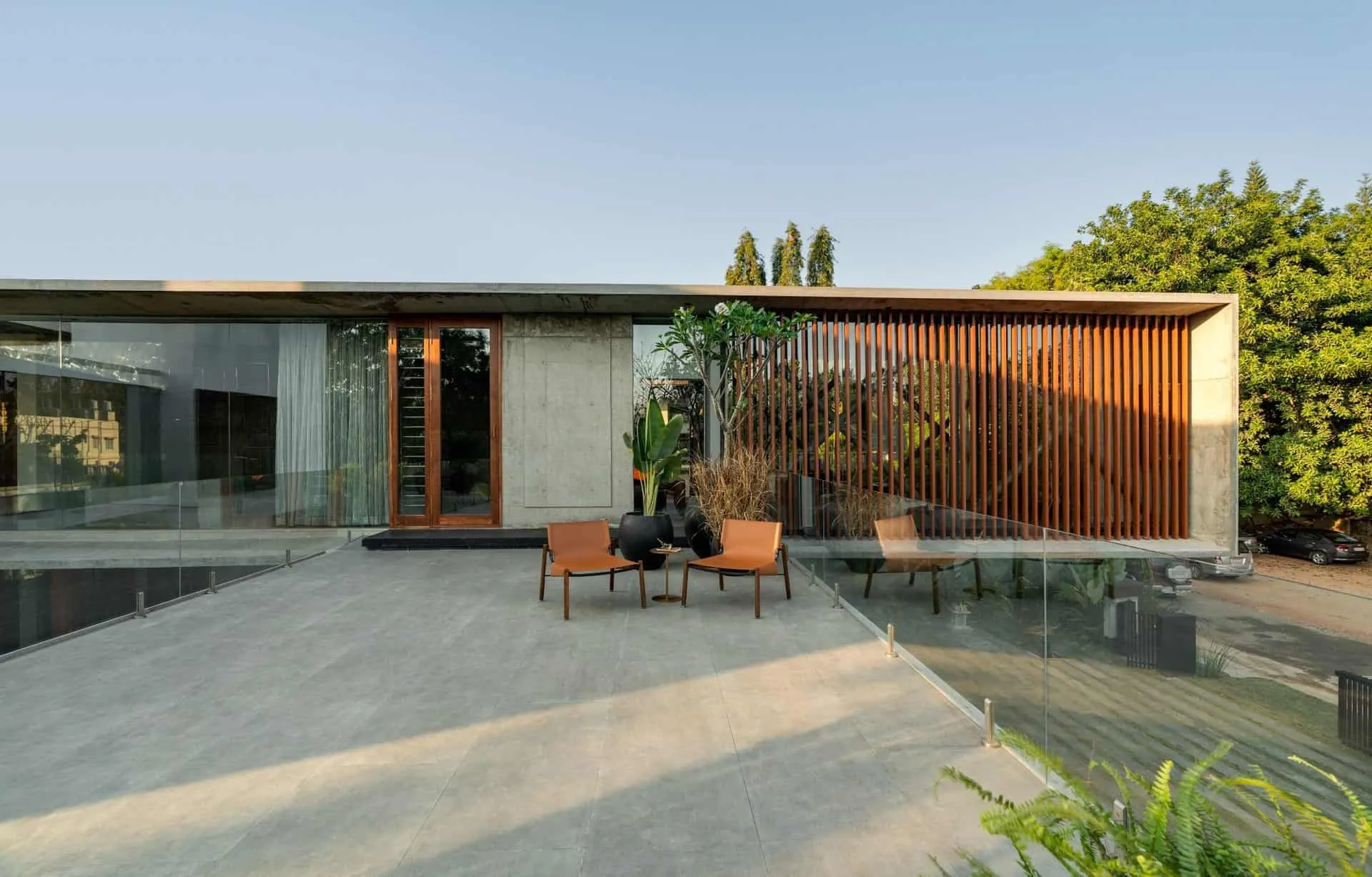 Minimalist House by Crest Architects — terrace with relaxation areas and glass railing, Bangalore, India