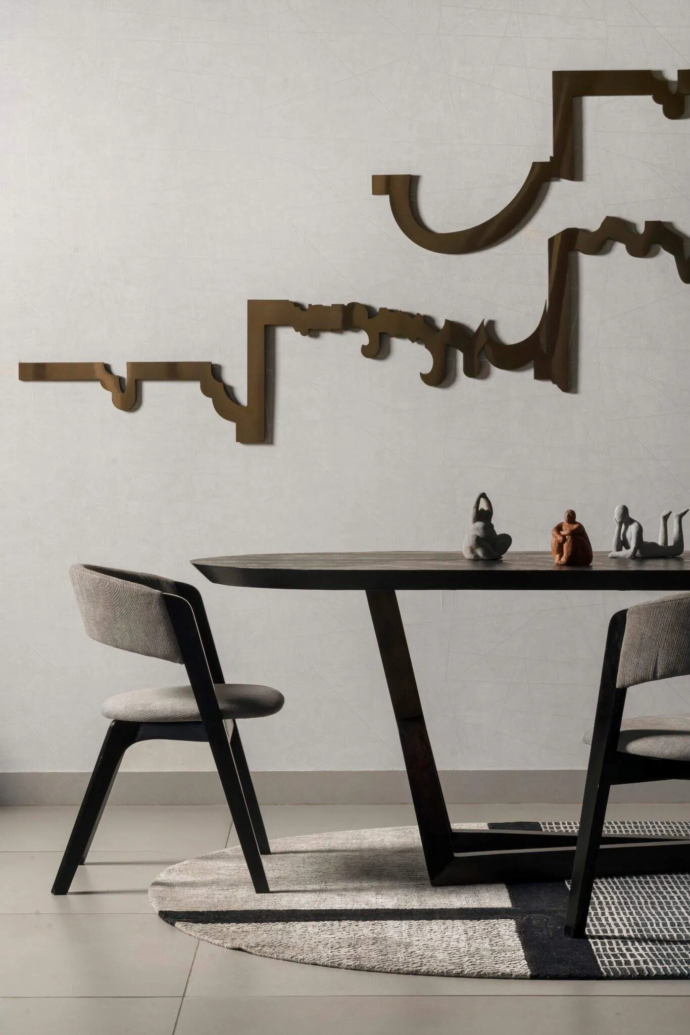 Close-up of wall with art in the dining area of UrbanMistrii's Pool House – Chatarpur, Delhi