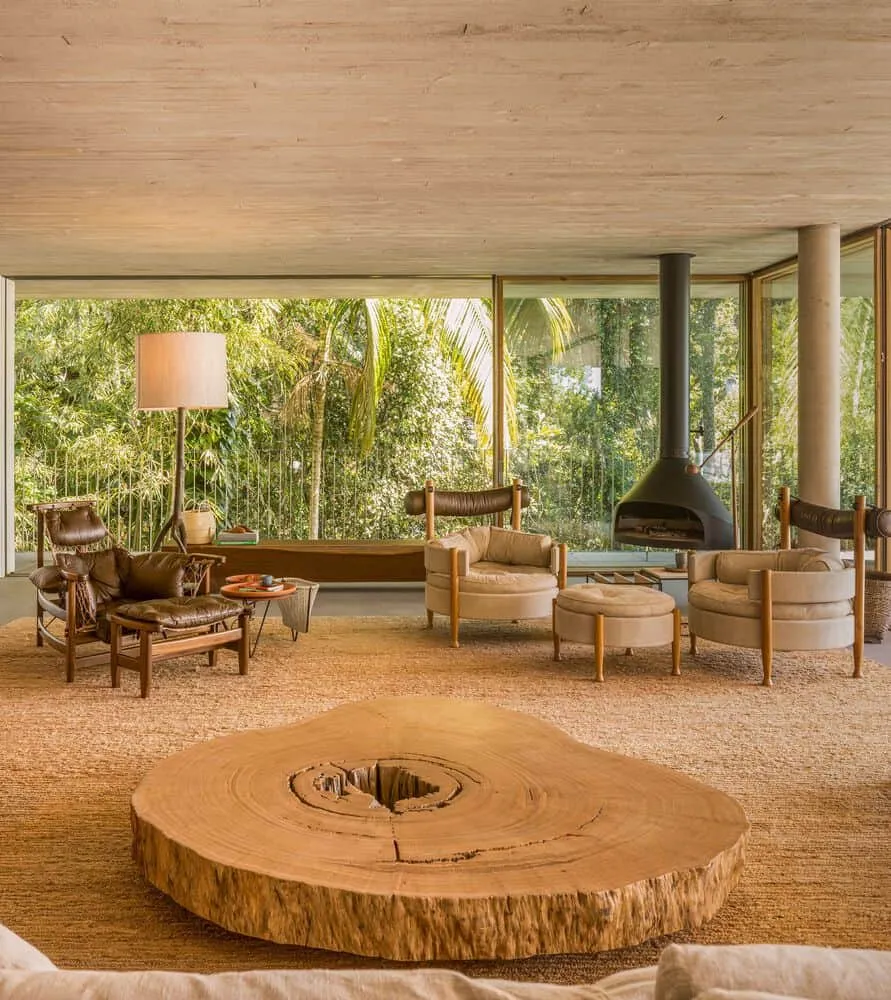 Canopy House by Studio MK27 – living room with large tree-slice table, Guarujá, Brazil