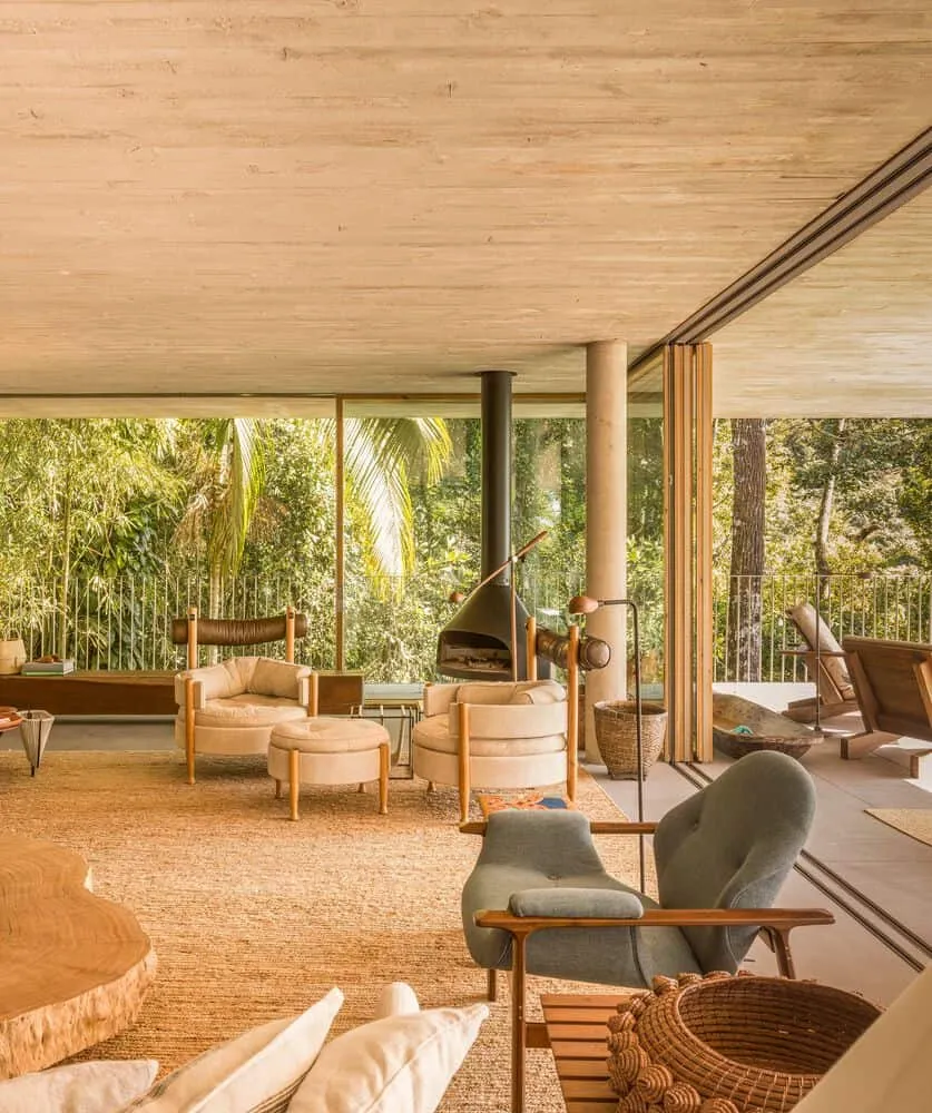Canopy House by Studio MK27 – living room with fireplace and seating, Guarujá, Brazil