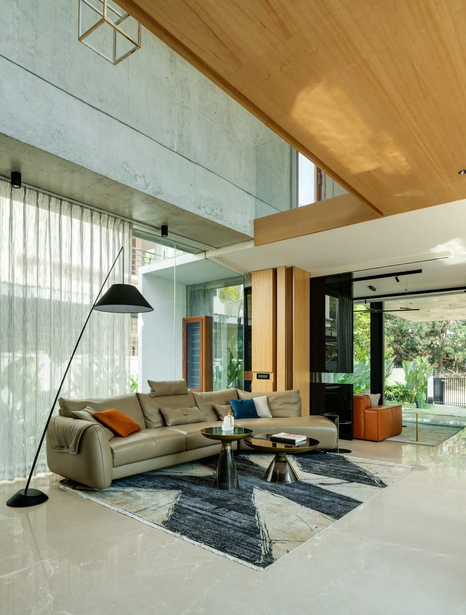 Minimalist House by Crest Architects — informal double-height living room, Bangalore, India