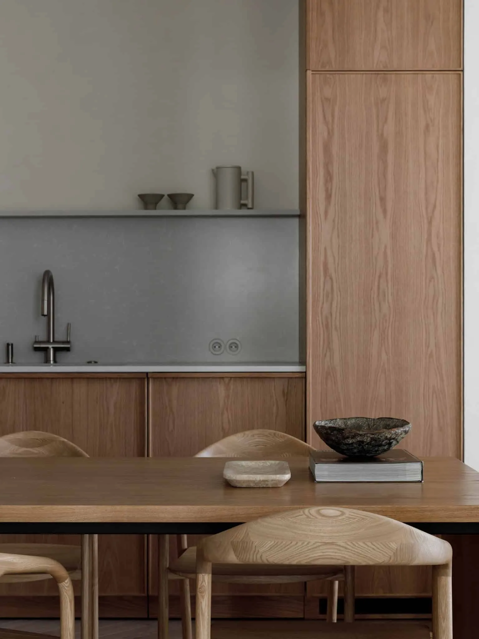 Lesoparkovy apartment — dining table on kitchen with bowl and books, STARIKOVA.ARCHITECTS, Chelyabinsk