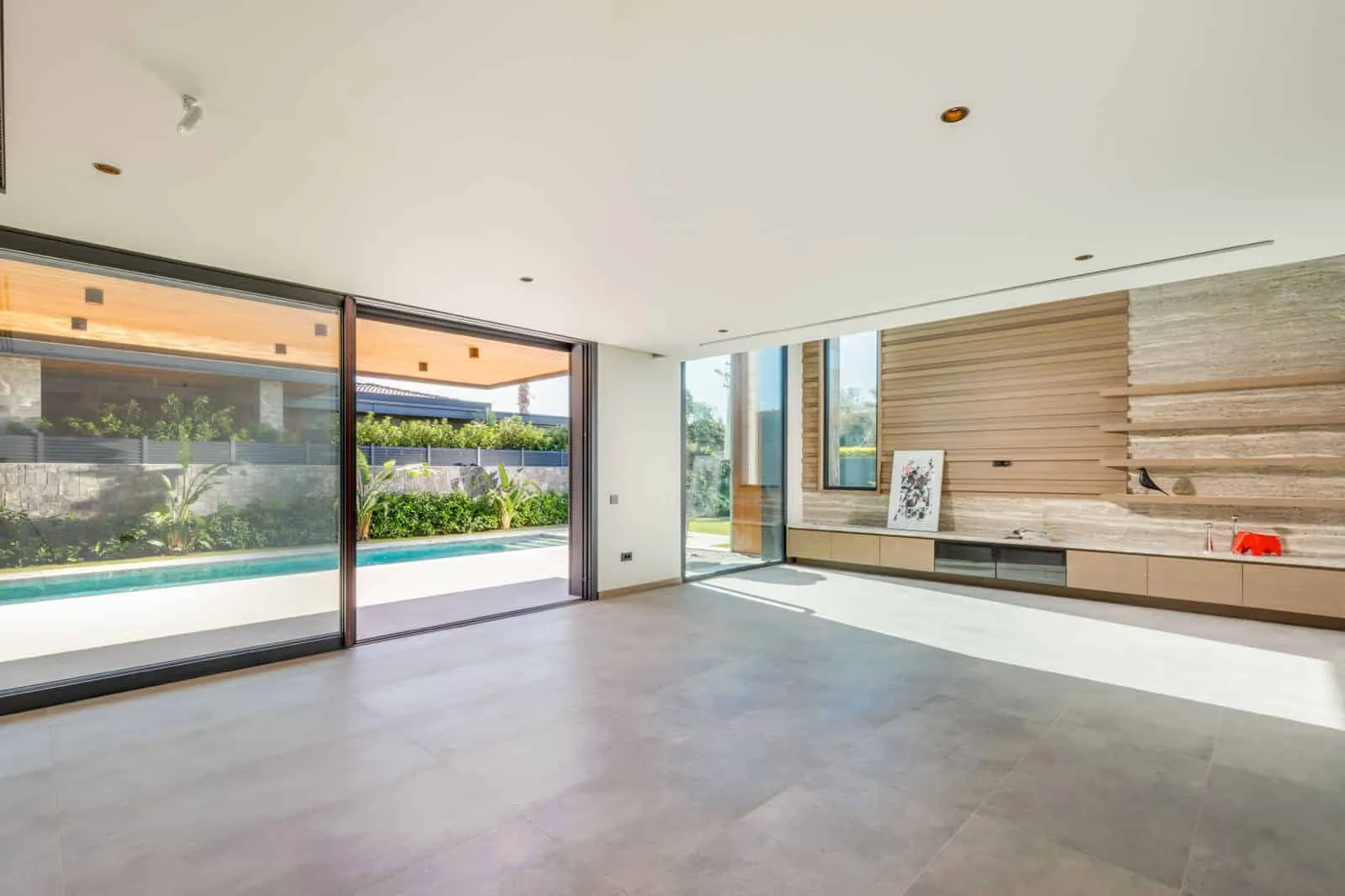 Casa Pendenza living room opening to pool by BAD – Başak Akkoyunlu Design, Mamurbaba, Çеşme, İzmir