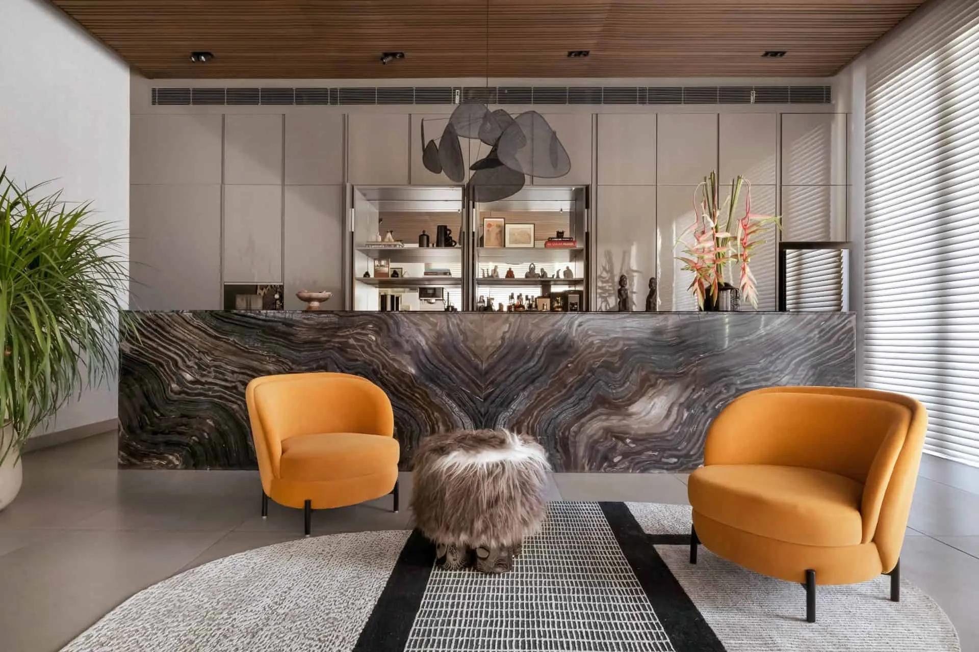 Seating arrangement in the bar lounge area of UrbanMistrii's Pool House – Chatarpur, Delhi