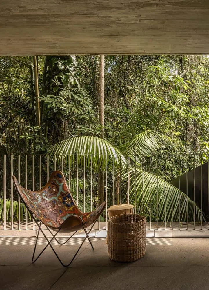 Canopy House by Studio MK27 – balcony with colorful chair and tropical view, Guarujá, Brazil
