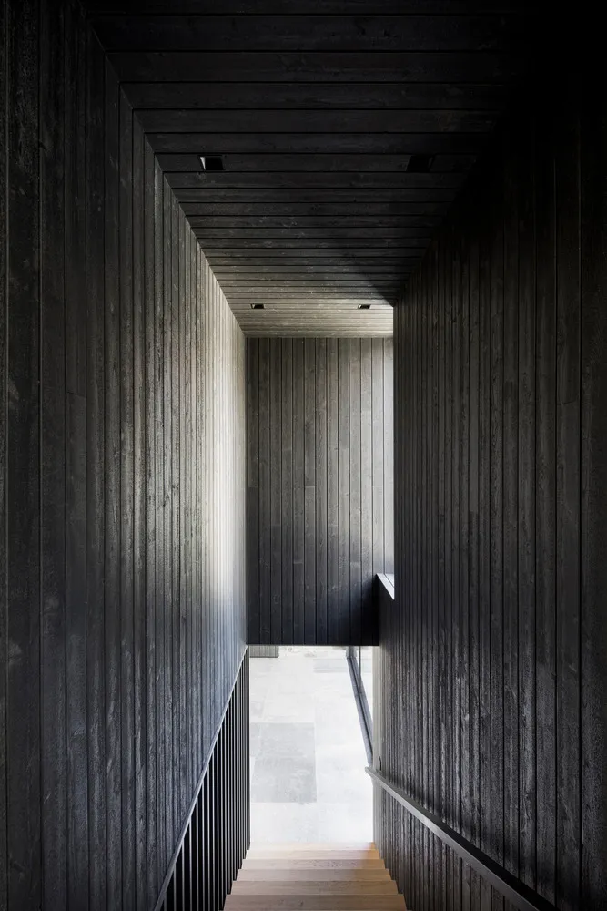 Minimalist wooden furniture in the La Baie de l'Ours house