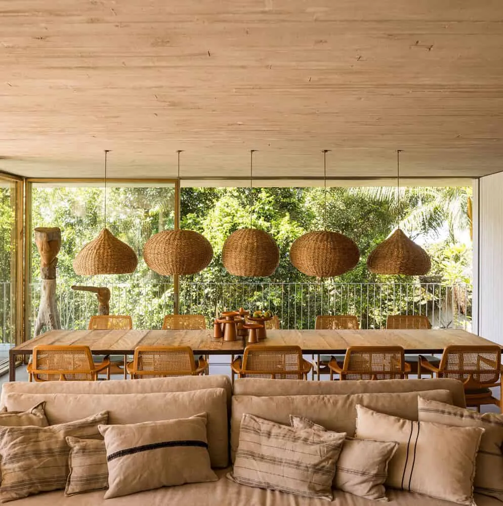 Canopy House by Studio MK27 – dining area with rattan pendant lamps, Guarujá, Brazil