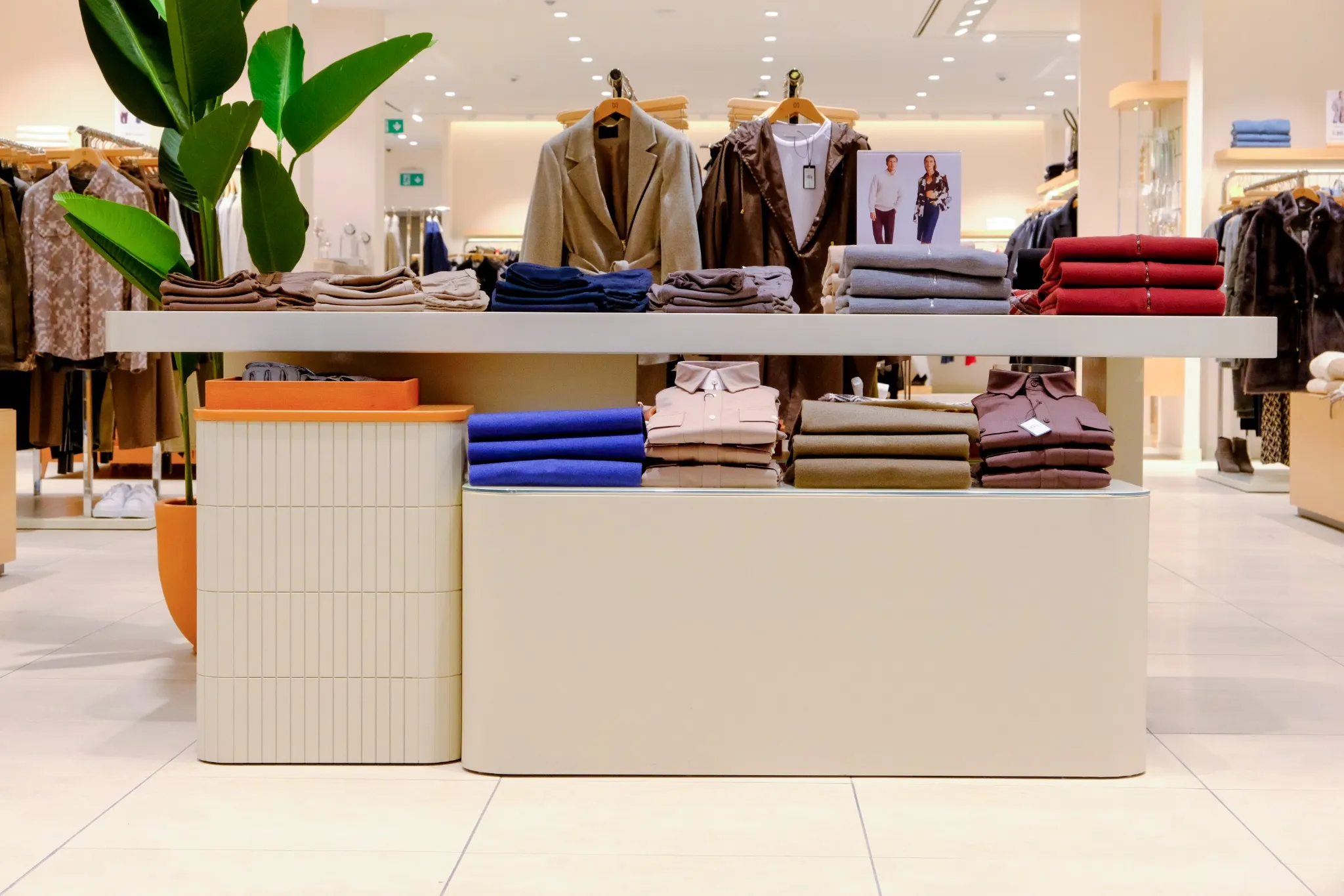 Central display window of NetWork Stores by Boytorun Architects with folded clothing in Turkey