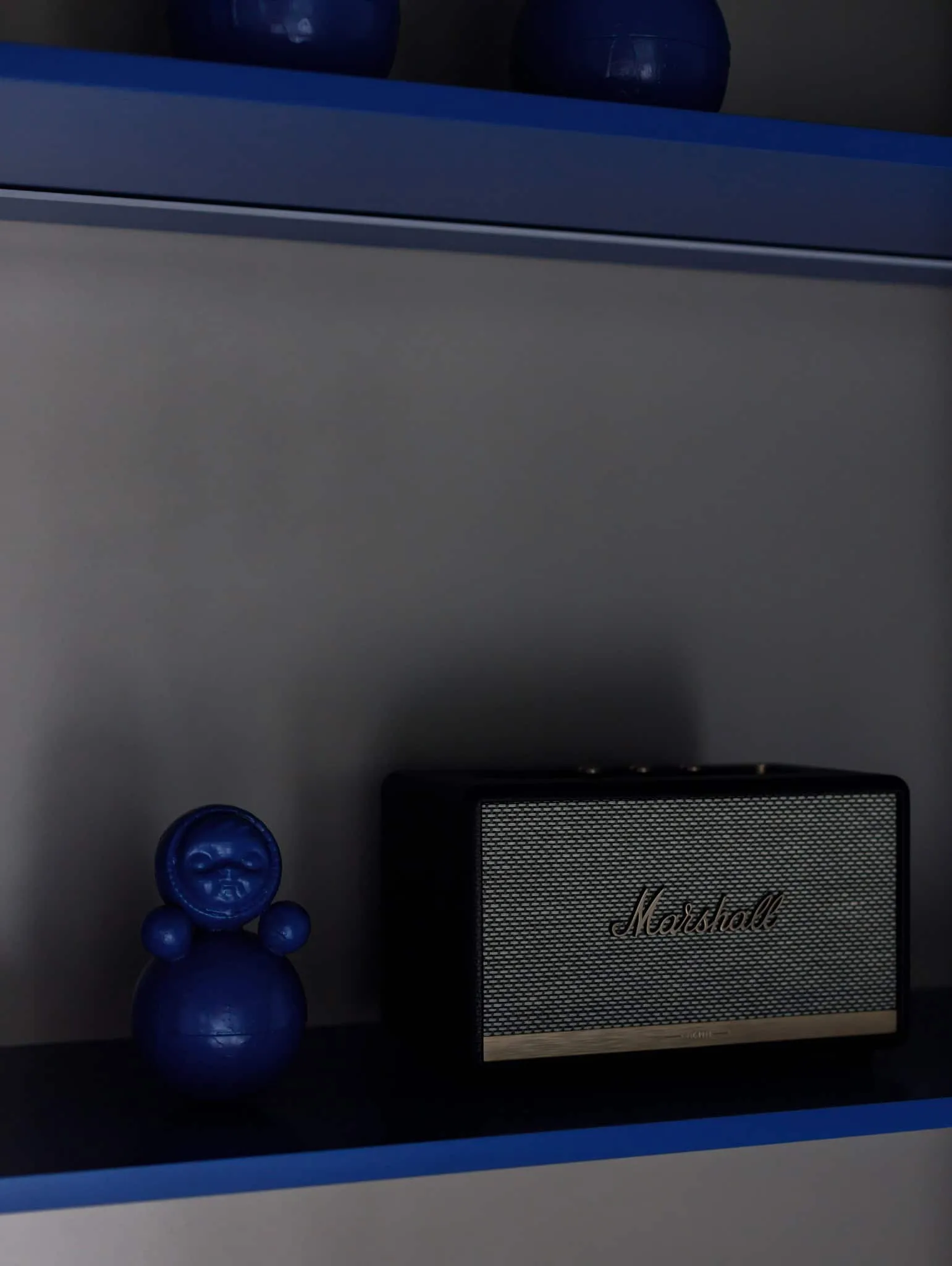 Modern minimalist interior by Julia Starikova – Marshall speaker and blue figurine in Chelyabinsk, Russia