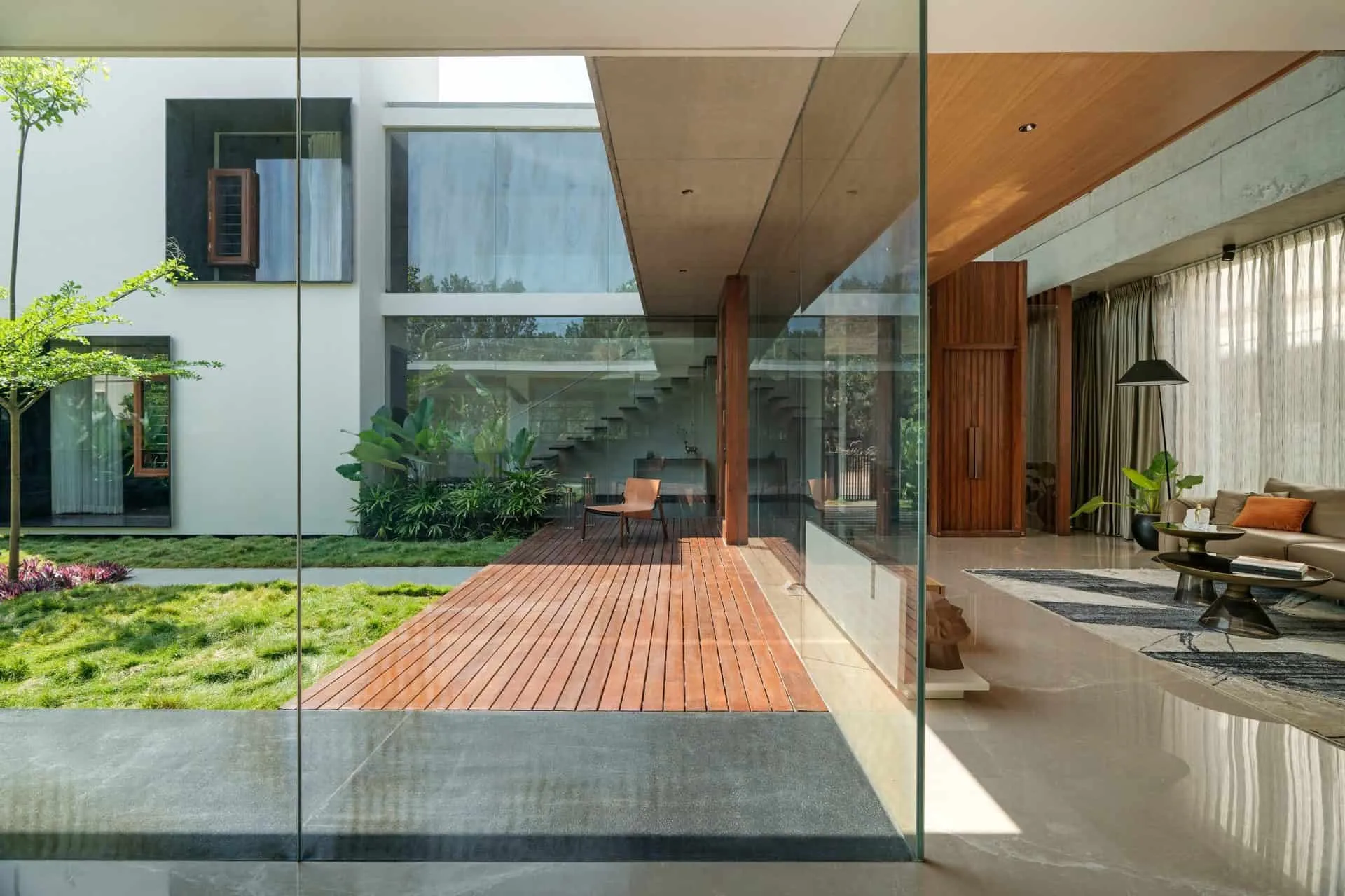Minimalist House by Crest Architects — informal living room and prayer room with view to inner courtyard, Bangalore, India