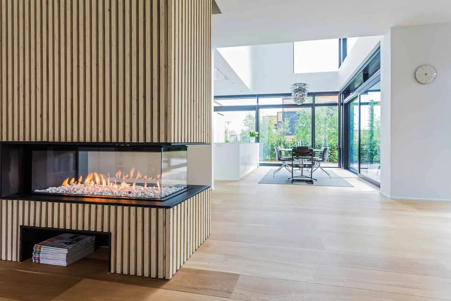 Villa S — wide glazing framing views to the forest boundary