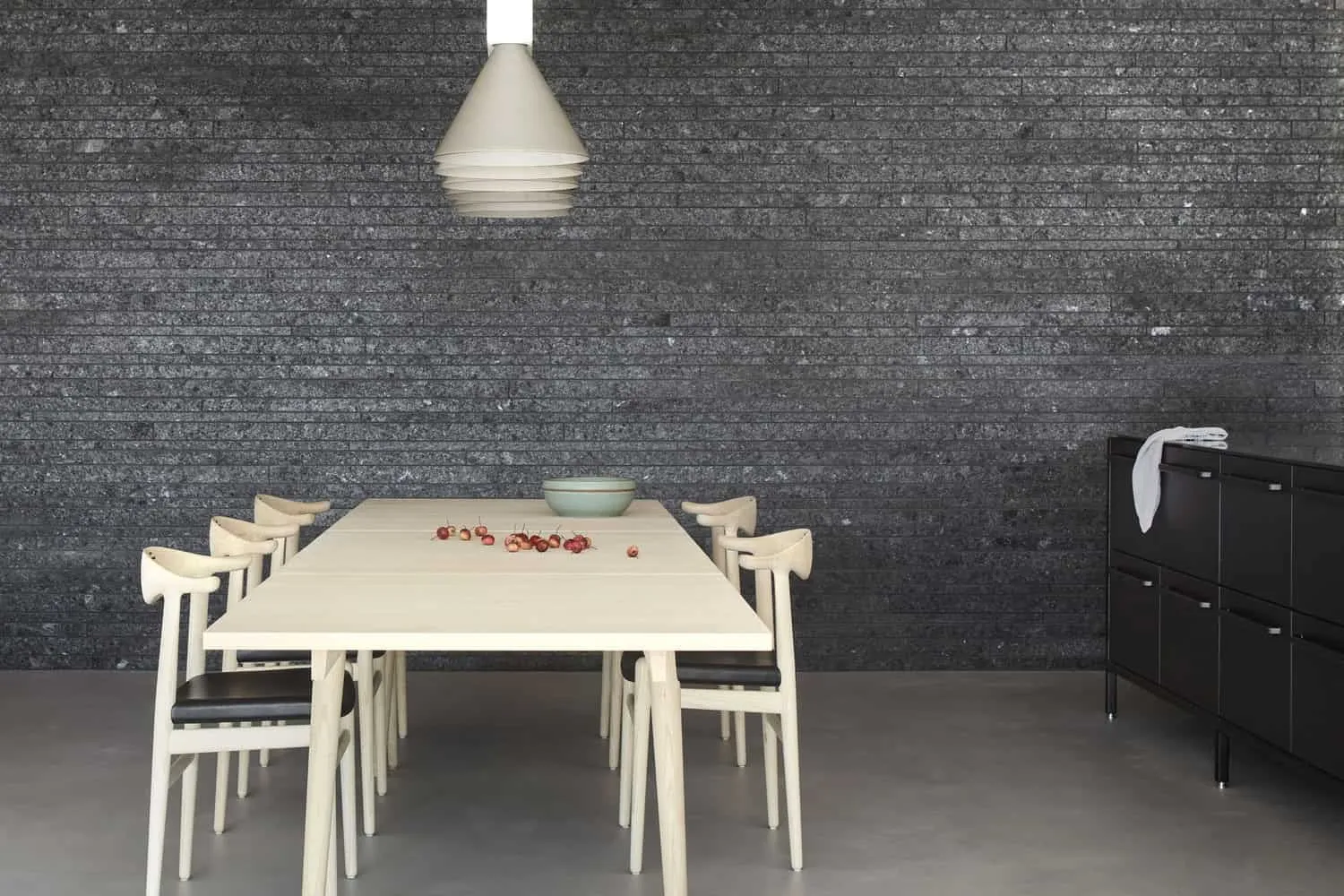 Dining Table and Chairs by Stone Wall of Sagamore North Cottage by Akb Architects