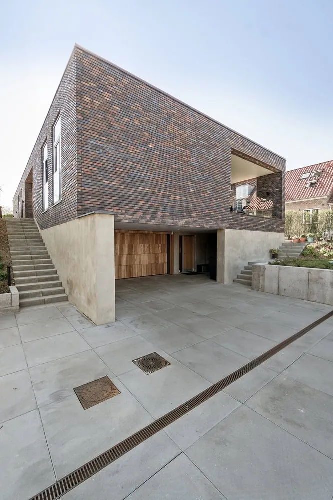 Garden-side elevation with terraces stepping into landscape