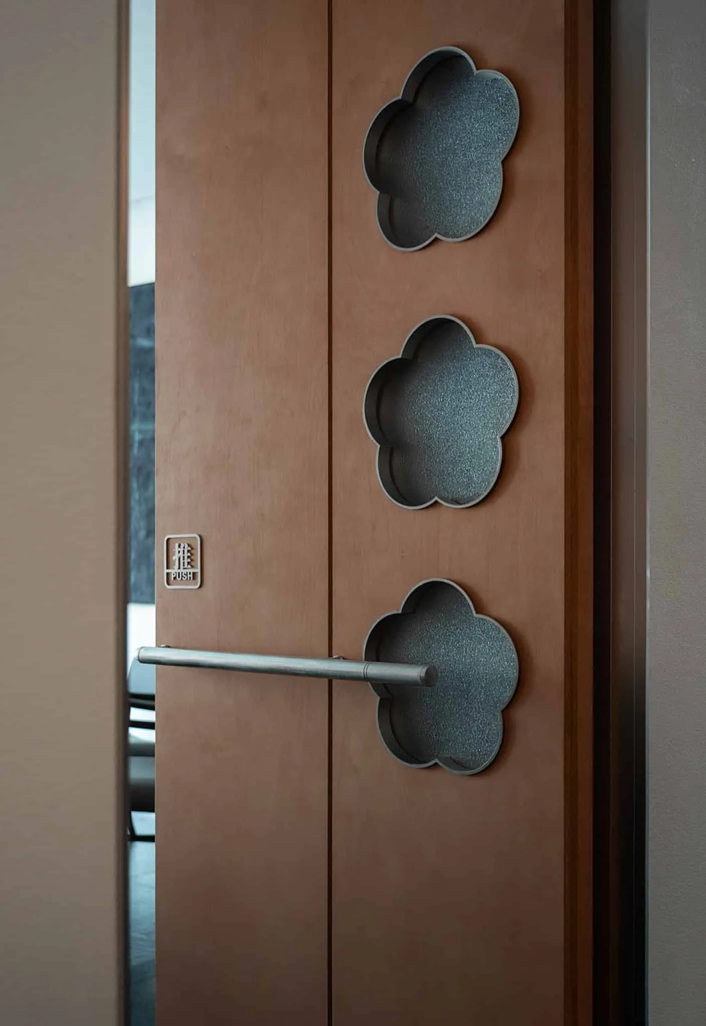 Yang Sin Lobster · Bai Jia Hu, by IN.X — door handle from polished steel through cloud cutout, Nanjing, China