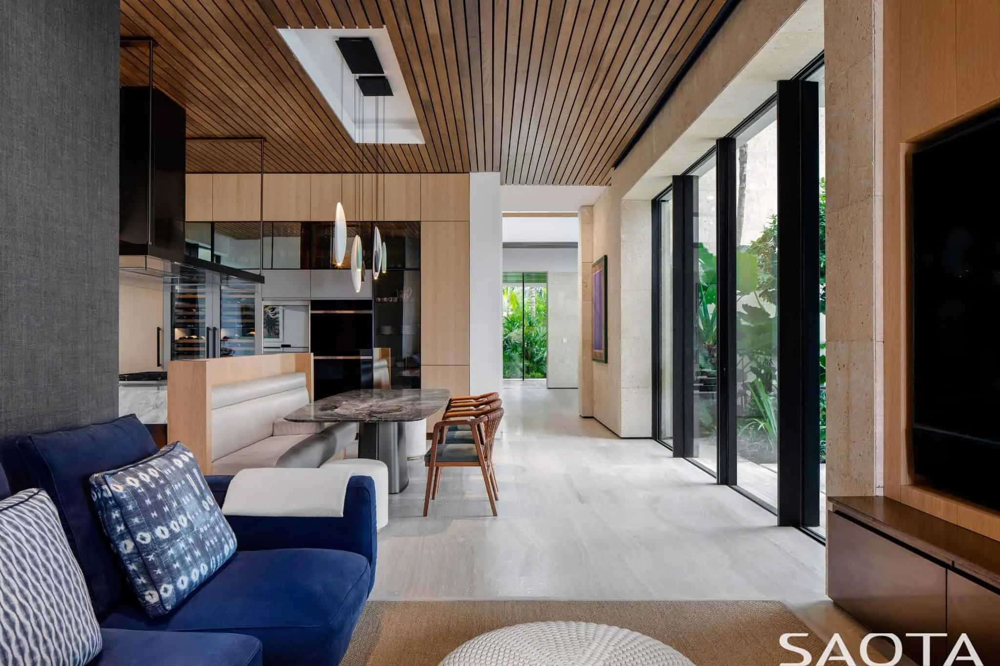 Kitchen and breakfast area with wooden ceiling and garden connection