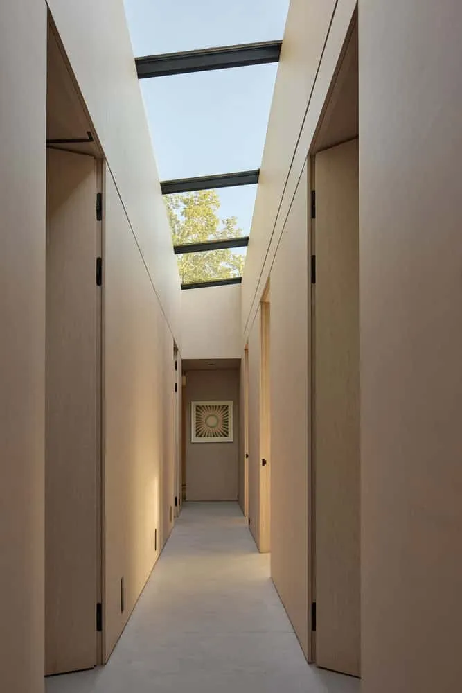 Corridor with Natural Light and Wood Cladding of Sagamore North Cottage, Mask