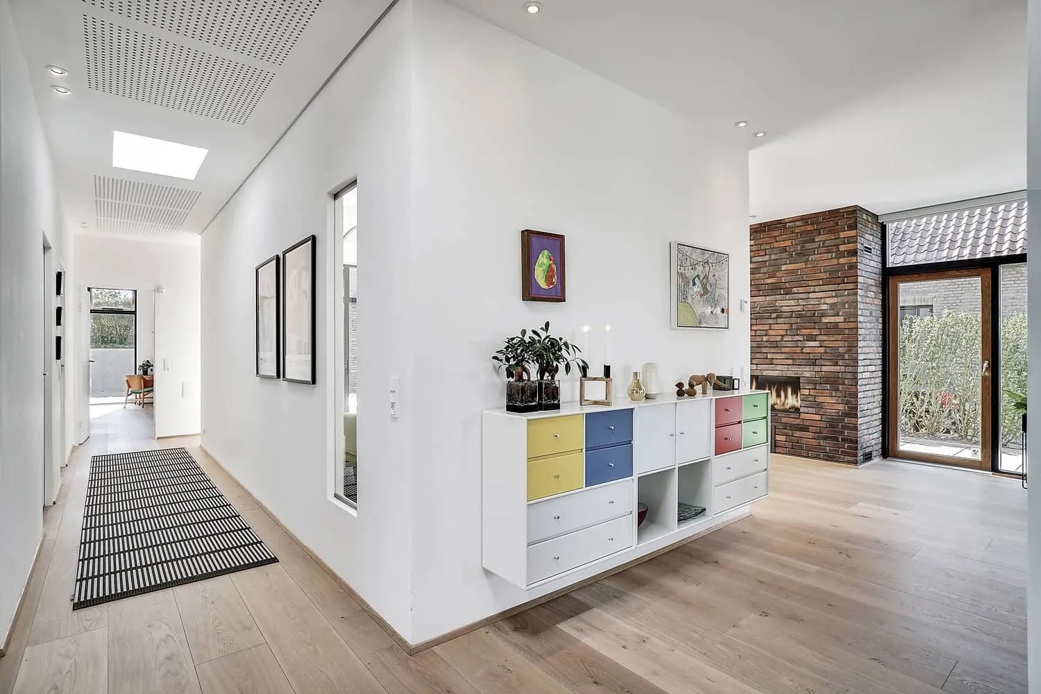 Detail of brick bonding, cedar soffits, and crisp metal framing