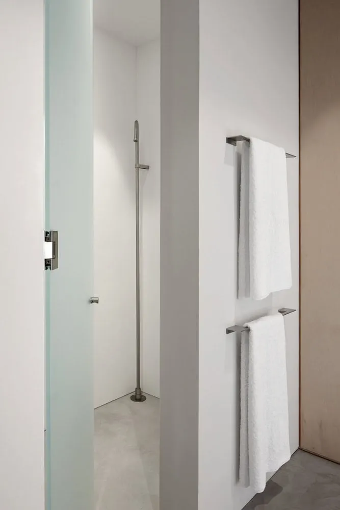 Minimalist Shower Area with Towel Rack and Concrete Floor of Sagamore North Cottage