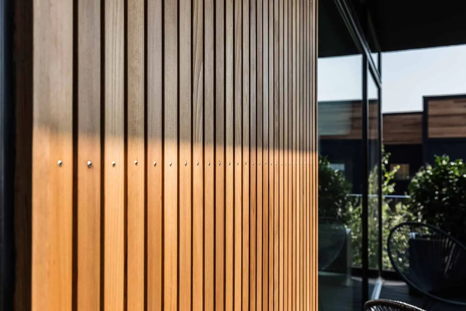 Villa S — approach to the house from neighbor side with multi-level volumes and controlled openings