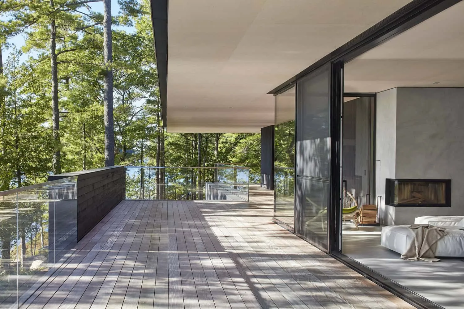 Wide Terrace Opening into Living Room of Sagamore North Cottage by Akb Architects, Mask