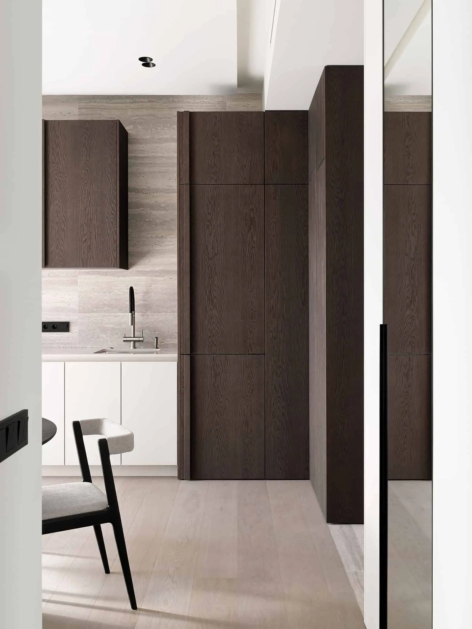 Kitchen view from doorway with oak cabinets and white front panel - warm minimalism in Moscow