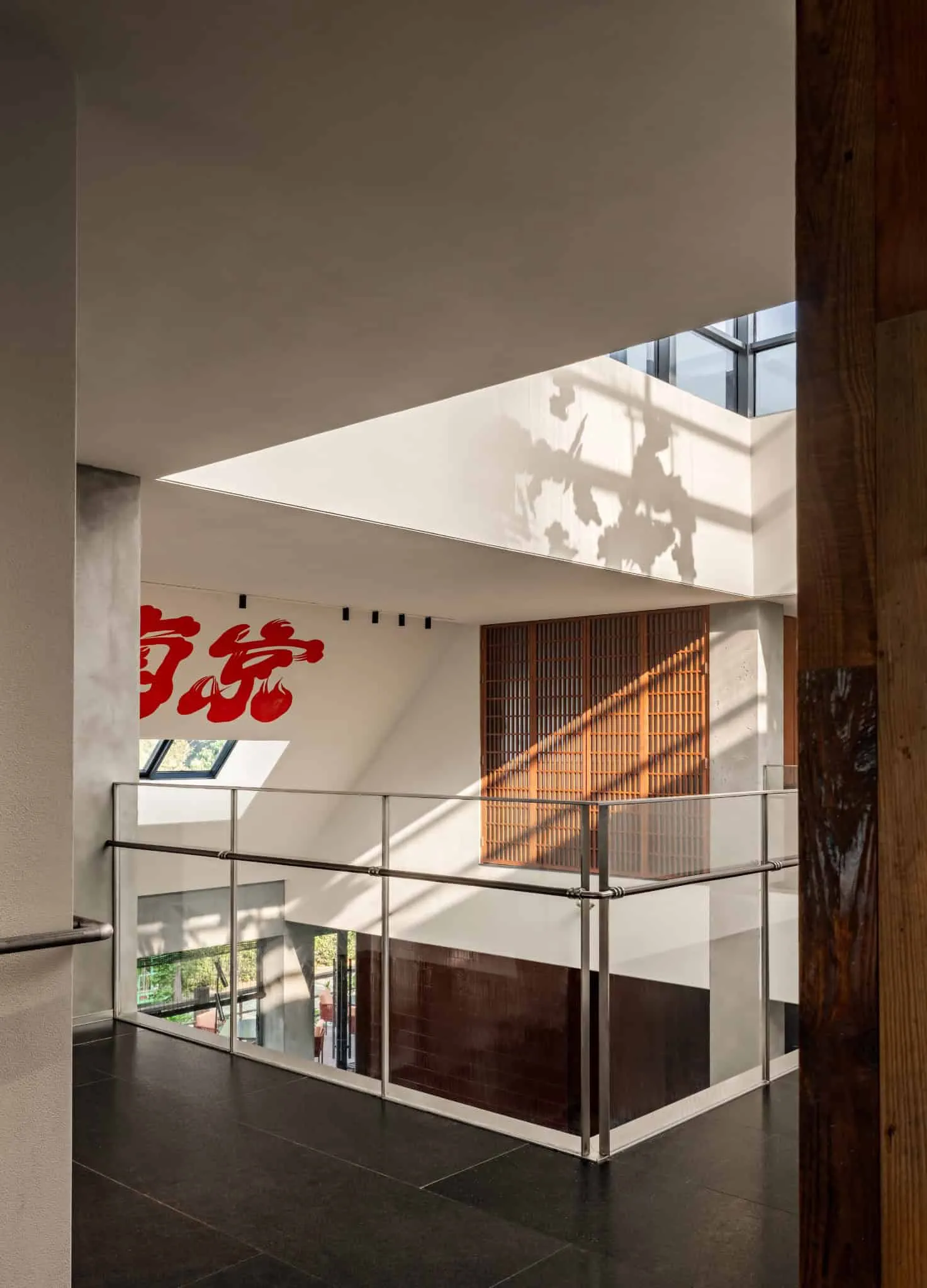 Yang Sin Lobster · Bai Jia Hu, by IN.X — light on atrium balcony, Nanjing, China
