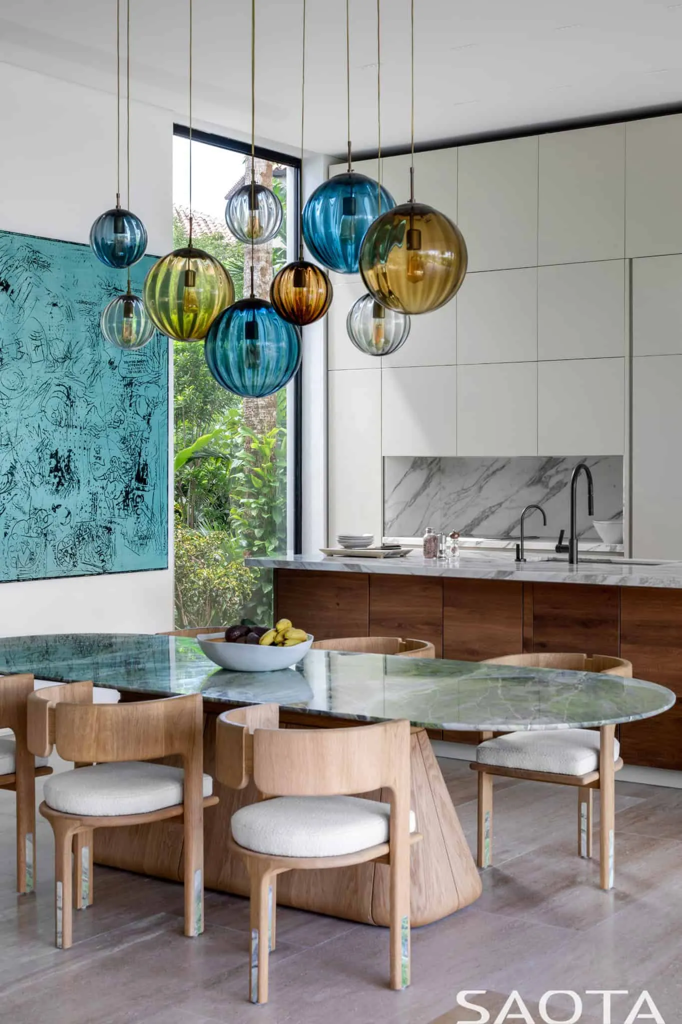 Dining room and kitchen with sculptural lighting