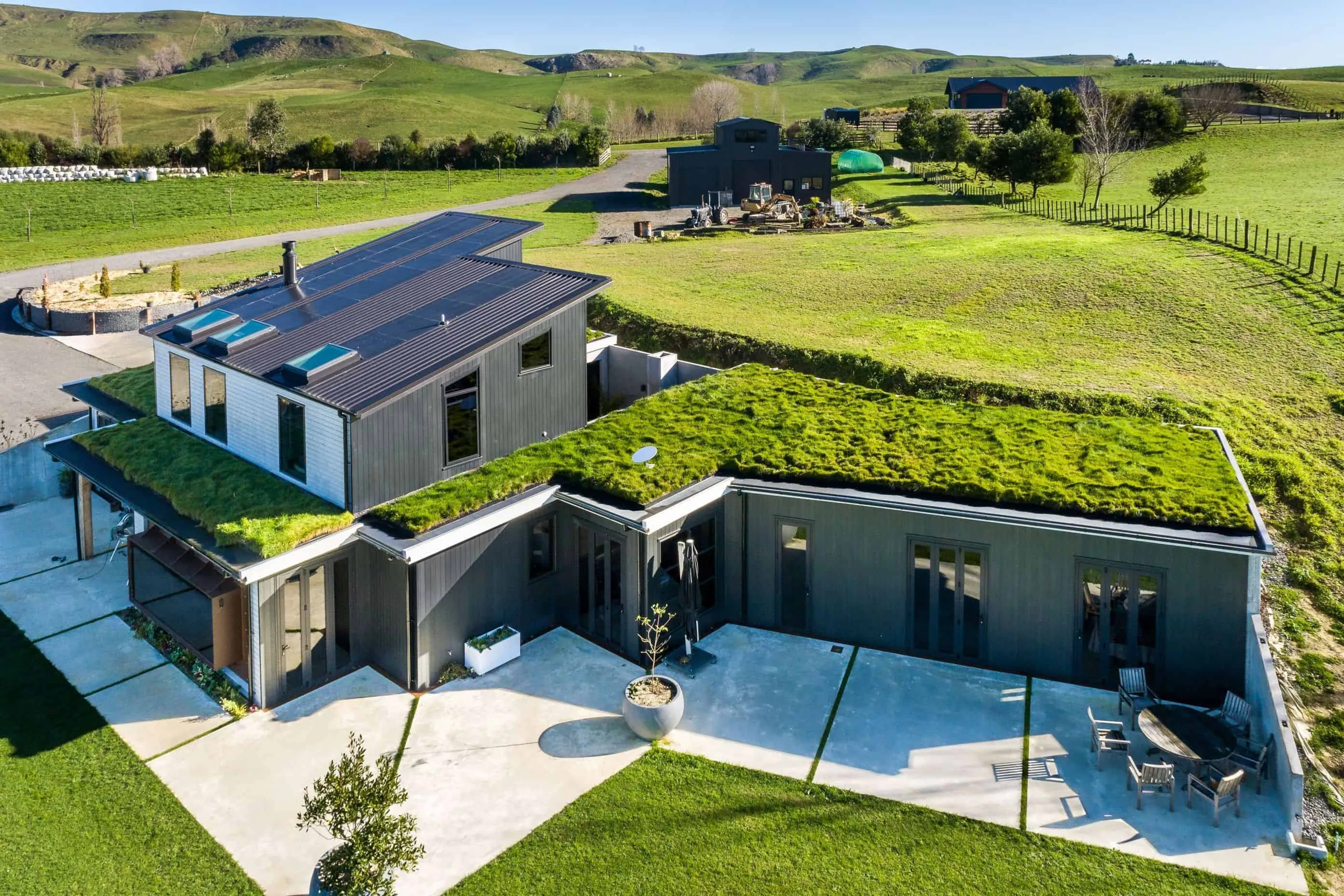 Modern building with green roof system – living vegetation covers sustainable garden design on the roof