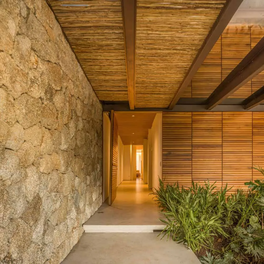 House TM by Jacobsen Arquitetura – entrance from stone and wood, Brazil