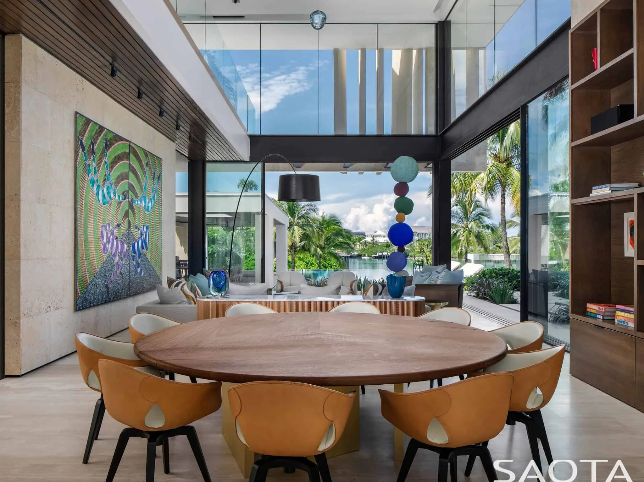 Double-height living and dining room enlivened by art