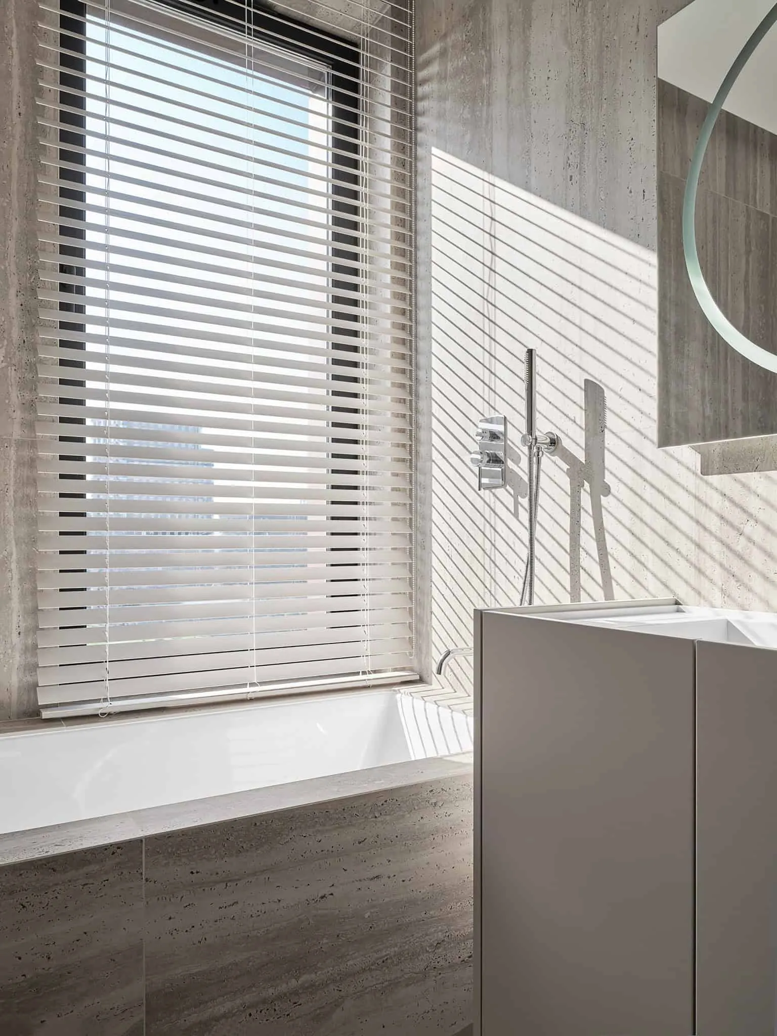 Bathtub under window with blinds - bathroom with warm minimalism, Moscow