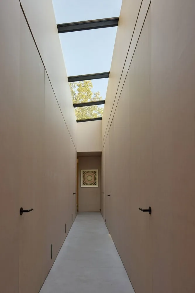Corridor with Lantern and Natural Wood Walls of Sagamore North Cottage by Akb Architects