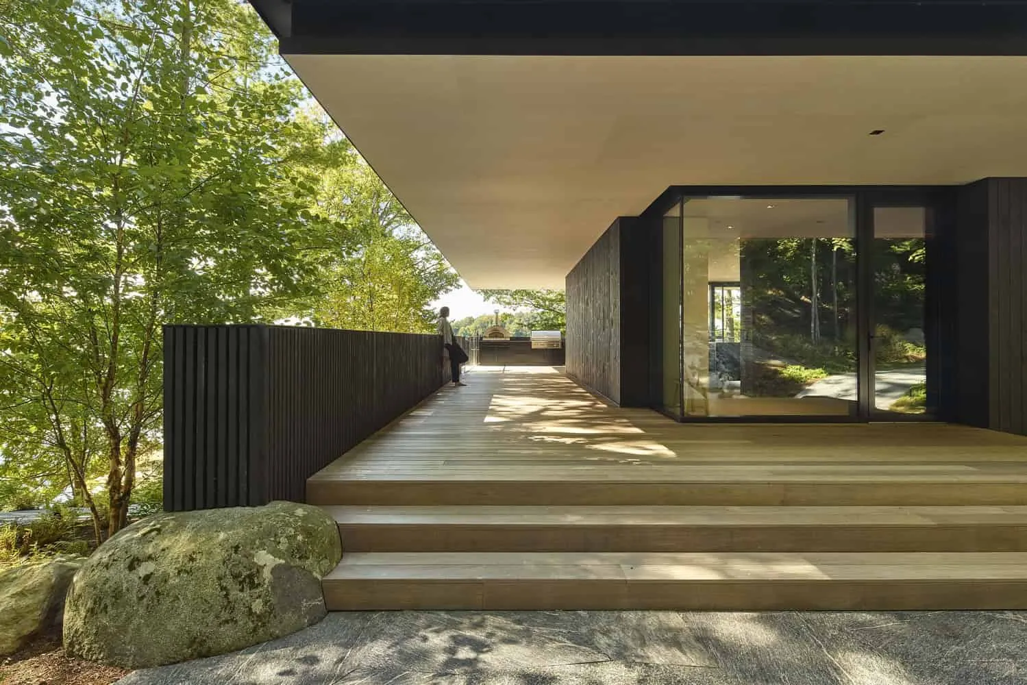 Terrace with Outdoor Kitchen of Sagamore North Cottage by Akb Architects in Mask, Ontario