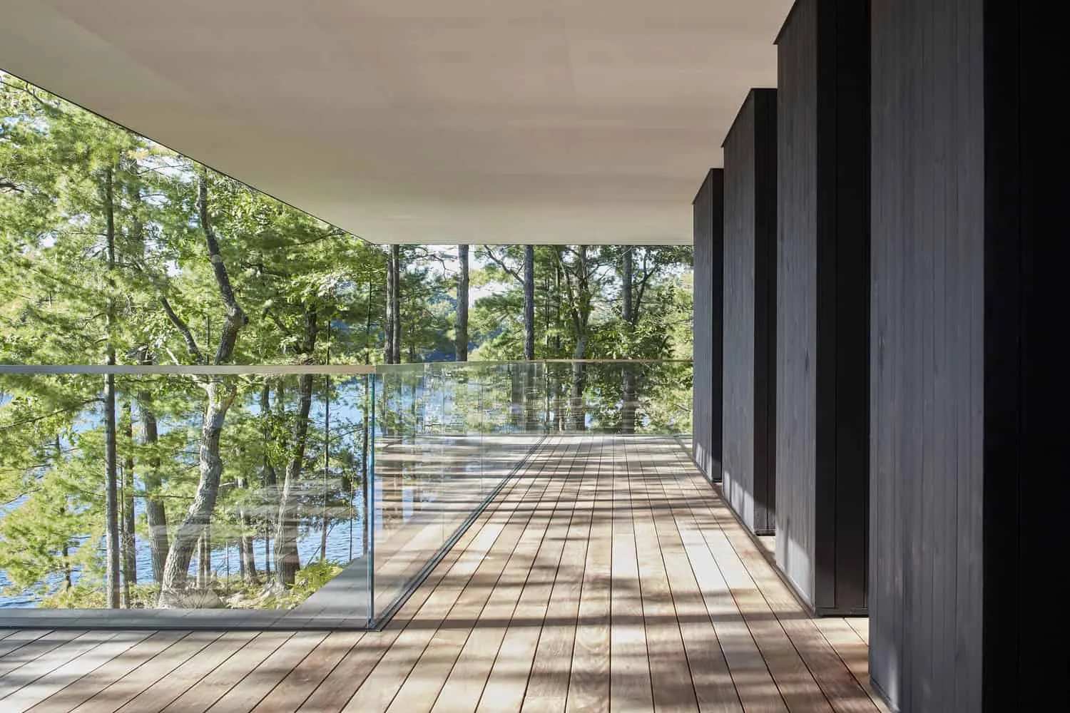 Balcony with Glass Railing of Sagamore North Cottage by Akb Architects, Mask