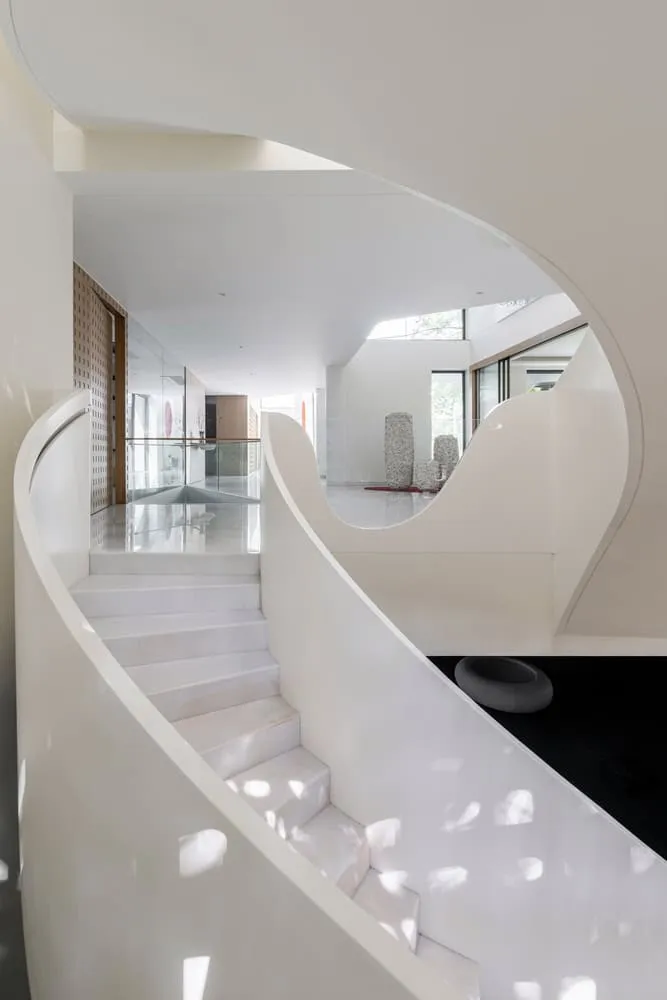 View from staircase landing to gallery in House NINE X NINE in Gandhinagar