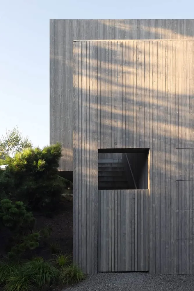Re-folded House Stair Entrance Wood Cladding by McLeod Bovell Modern Houses Re-folded House by McLeod Bovell Modern Houses, stair entrance framed with wood cladding, Vancouver