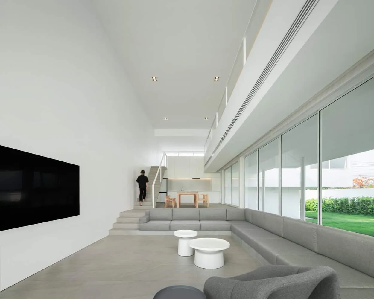 CORE Cluster设计的Lucent House客厅与厨房相连区域 泰国帕南地区CORE Cluster设计的Lucent House内的客厅与厨房相连区域