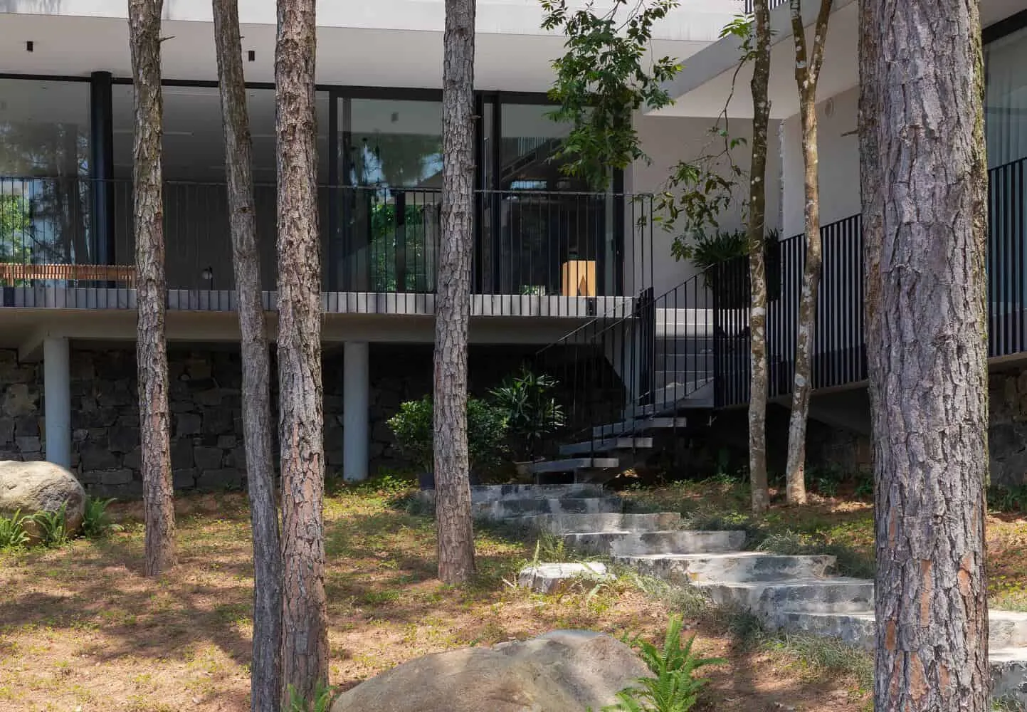 Tam Dao Retreat House elevated terrace stairs by Idee architects Tam Dao Retreat House by Idee architects elevated terrace with exterior stairs in Tam Dao, Vietnam