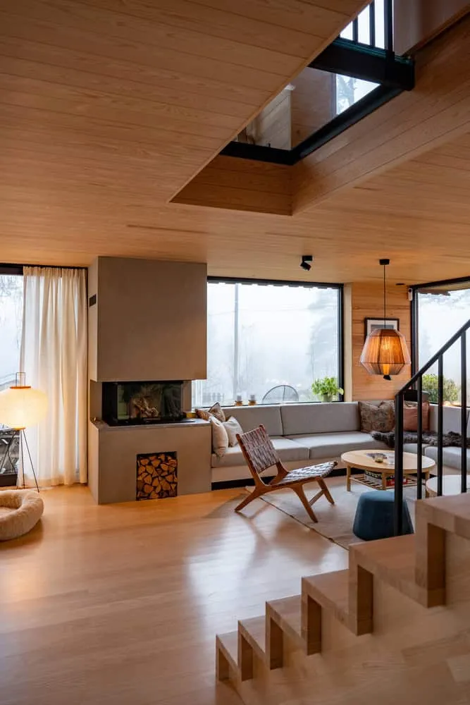 Solem Forest House Living Room Fireplace – MORFEUS arkitekter Solem Forest House by MORFEUS arkitekter, warm living room with fireplace and wood interior