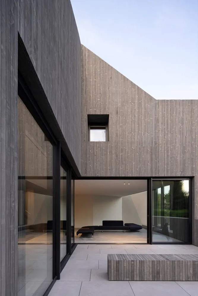 Re-folded House Courtyard Sliders Living View by McLeod Bovell Modern Houses Re-folded House by McLeod Bovell Modern Houses, courtyard with sliders to living room, Vancouver